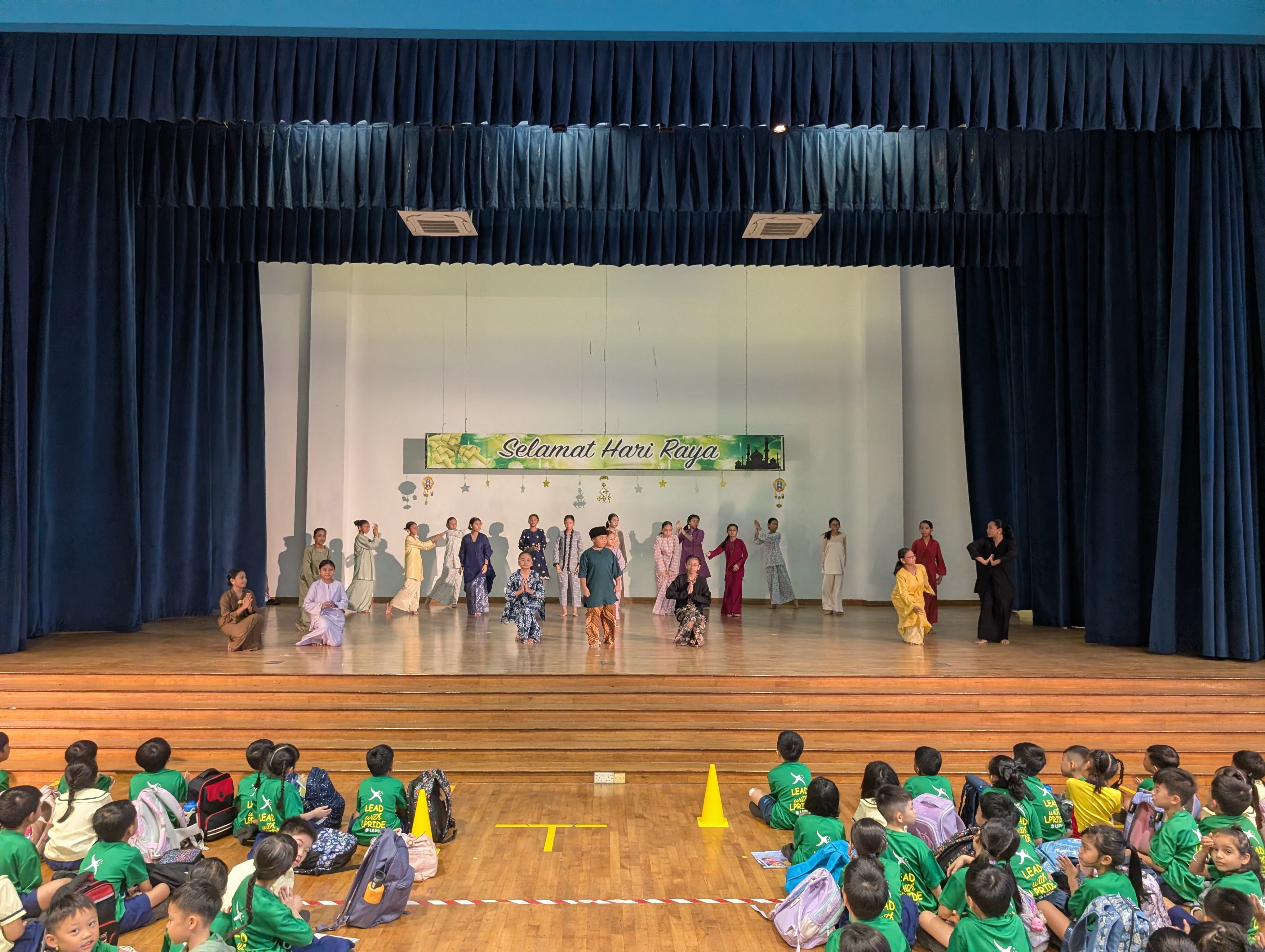 Our pupils bring Malay culture to life through a graceful and expressive dance on stage